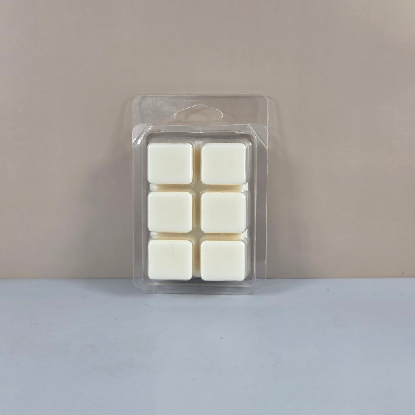 6-cube plastic clamshell packaging showcasing off-white, hand-poured soy wax melts.