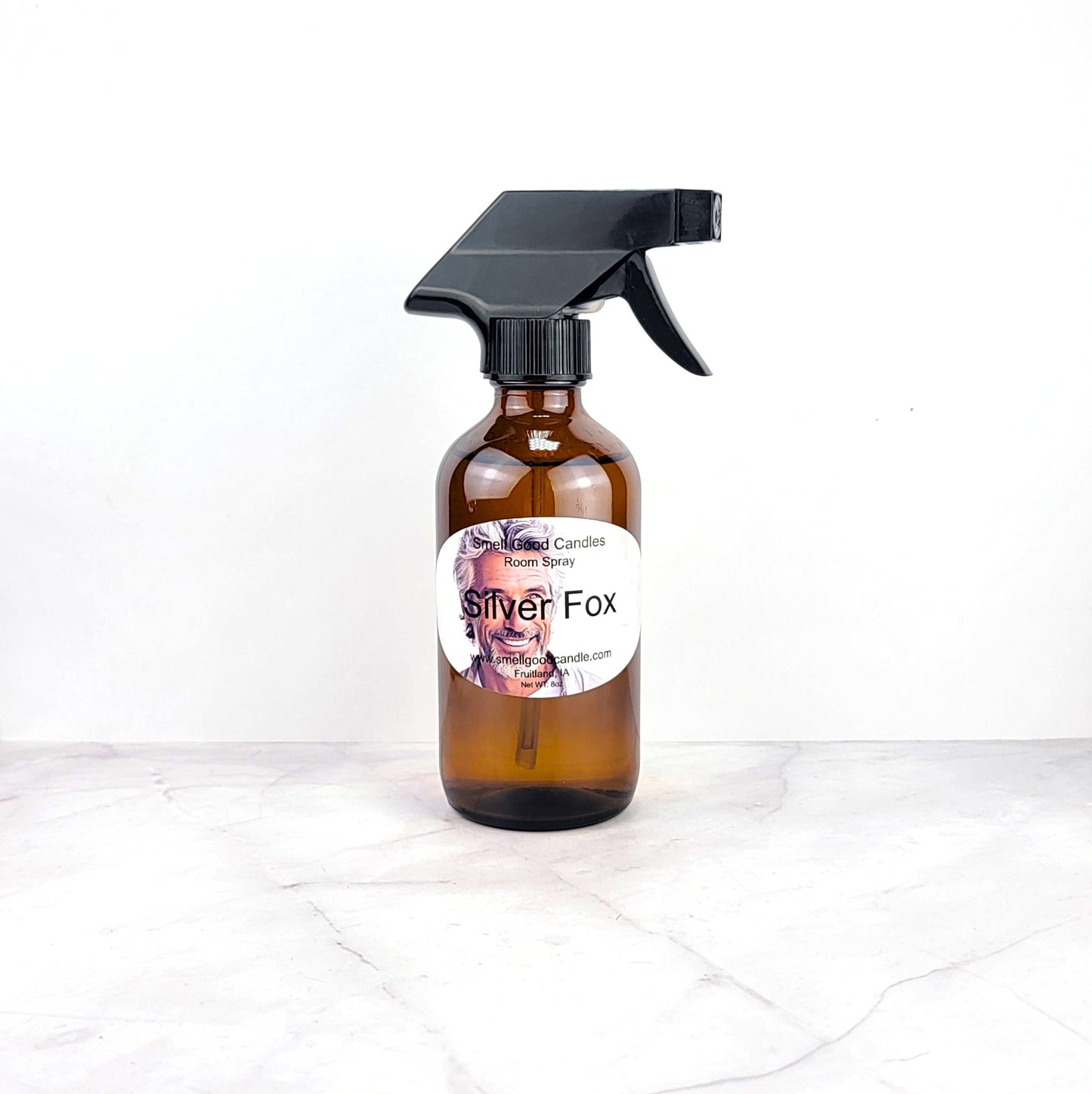 A mist of room spray filling the air with rich, masculine fragrance
