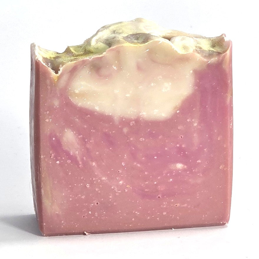 Textured top and pink-and-white marbled design of a handcrafted Winter Mittens cold process soap bar.
