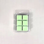 Clear 6-cavity clamshell packaging featuring vibrant light green soy wax melt cubes for home fragrance.