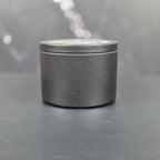 Alpine Balsam soy candle in matte black jar by Smell Good Candles -elegant hand-poured holiday scent.
