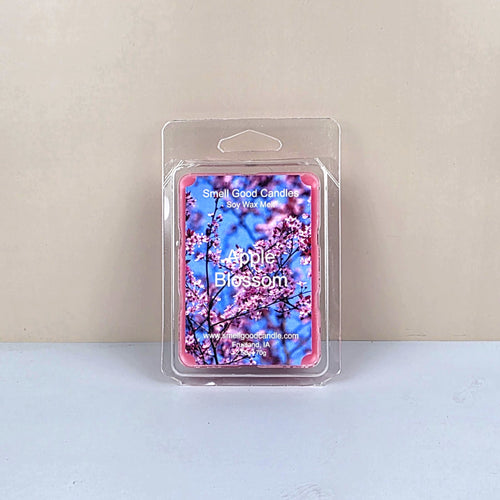 Packaged Apple Blossom wax melt with floral design on a light background