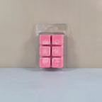 6-cavity clear plastic clamshell packaging filled with bright pink six-cube soy wax melts