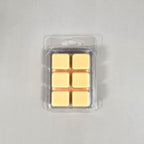 Clear 6-cavity clamshell packaging showcasing cream-colored, hand-poured soy wax melt cubes for home fragrance.