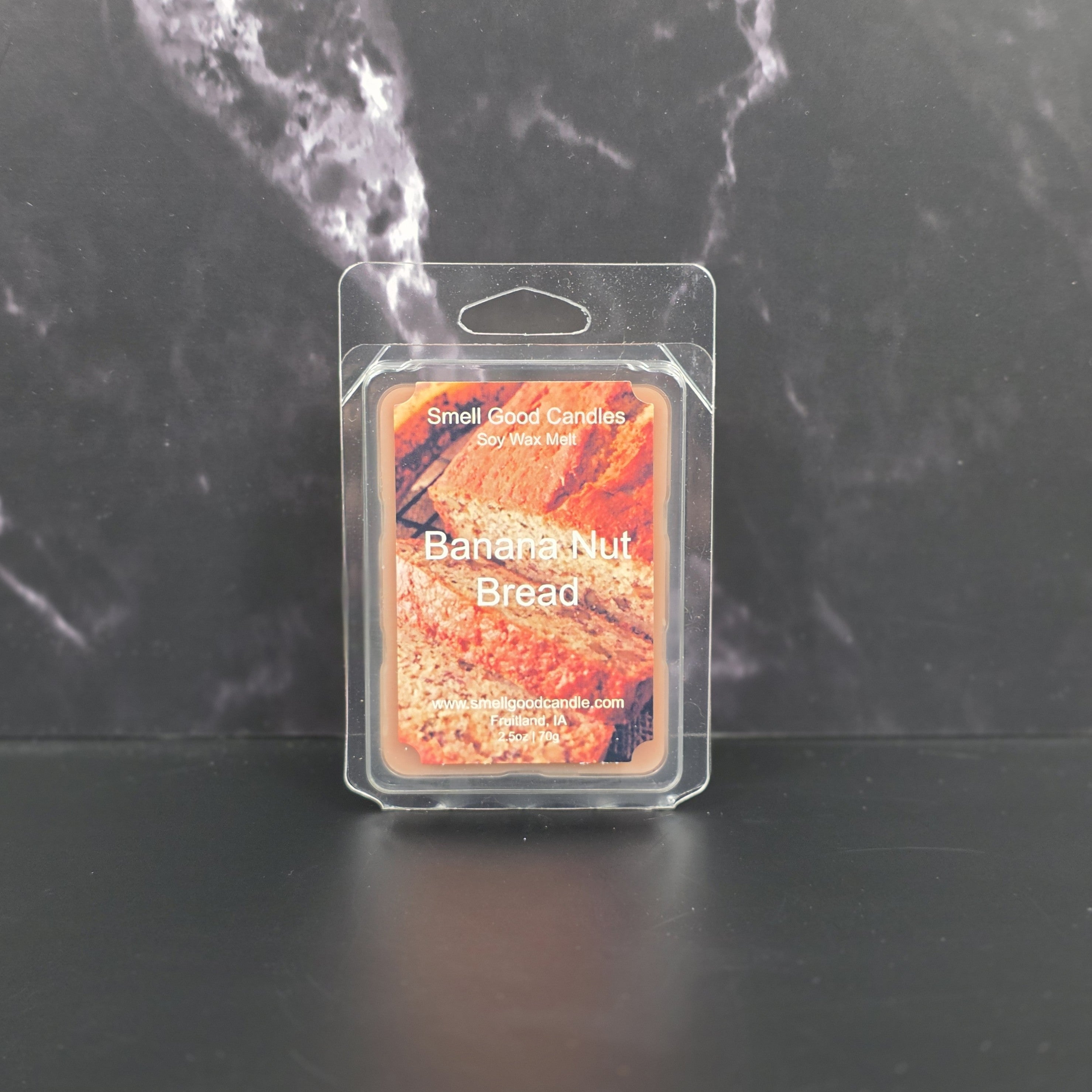 Wax melt packaging labeled 'Banana Nut Bread' by Small Good Candles on a dark background