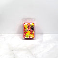 Candle melt wax bar in packaging with fruit illustration on a white background