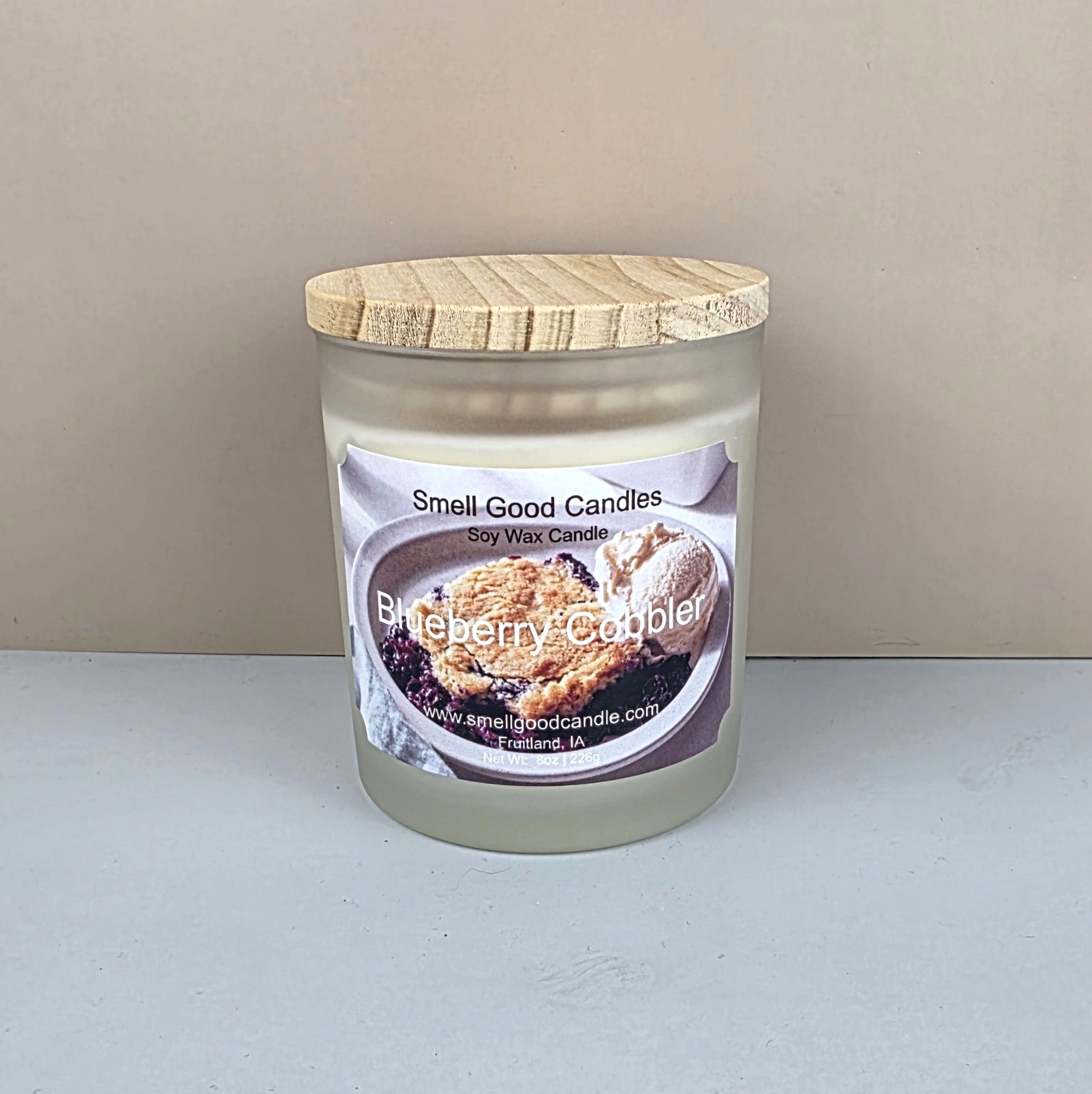 White frosted glass candle with wooden lid