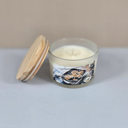 Top-down view of a 4oz soy wax candle in a clear glass jar, showcasing the smooth white wax and a single centered cotton wick.