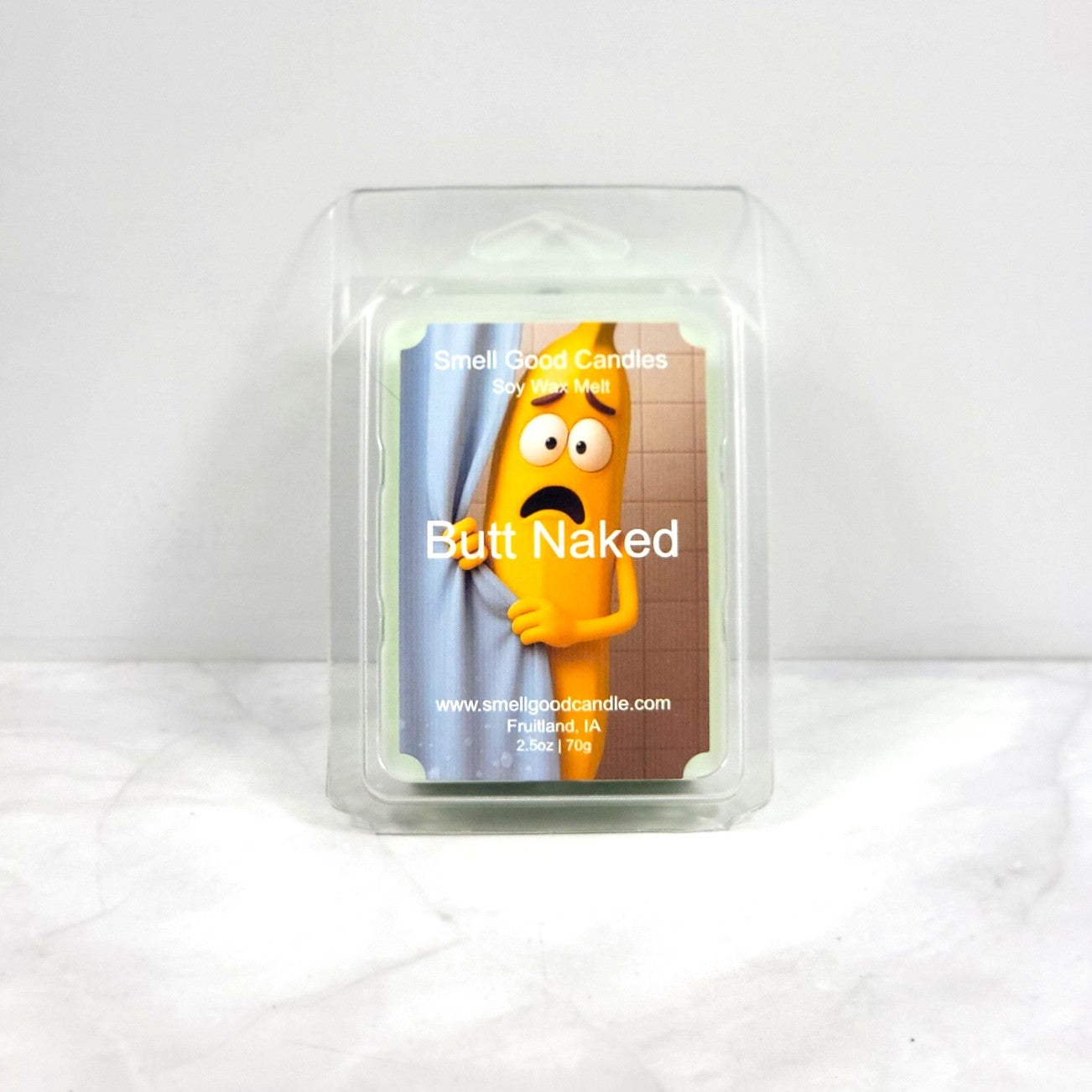 Candle packaging with cartoon character and 'Butt Naked' text on a white background