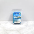 Caribbean Escape soy wax melt with tropical fruit and beach background