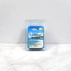 Caribbean Escape soy wax melt with tropical fruit and beach background