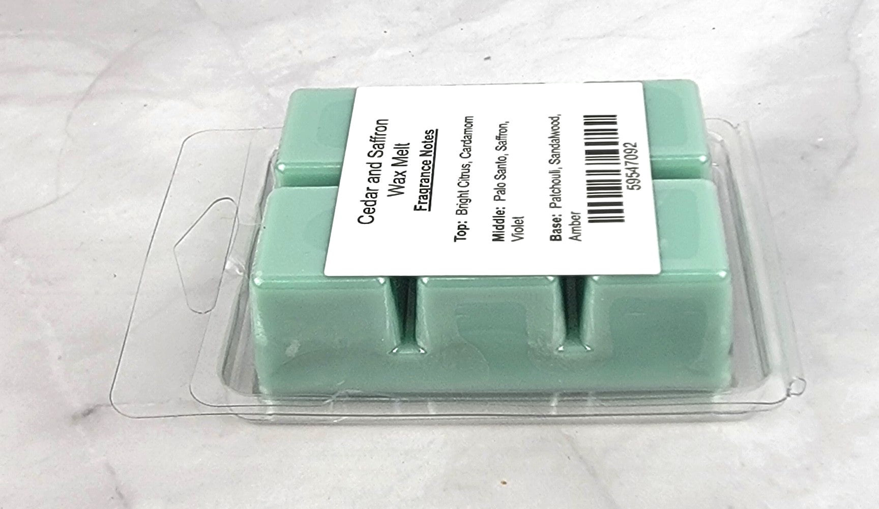 Handcrafted soy wax melt featuring cedarwood, saffron, and sandalwood aroma