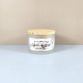 Luxury soy candle in white frosted jar, Clean Cotton scent, minimalist home decor.