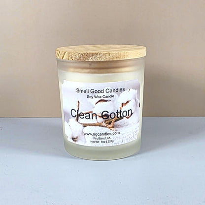 Luxury soy candle in white frosted jar, Clean Cotton scent, minimalist home decor.