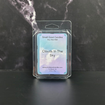 Clouds In The Sky Soy Wax Melts with airy coconut, vanilla, citrus, and warm wood fragrance notes