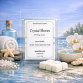 Crystal Shores white soy wax melts by Smell Good Candles in clear rectangular clamshell packaging with six white wax melt cubes displayed on a clean aquatic background.
