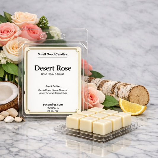 Desert Rose soy wax melt by Smell Good Candles on a marble surface, featuring crisp floral and citrus notes of cactus flower, apple blossom, lemon verbena, and coconut husk, shown with white wax cubes