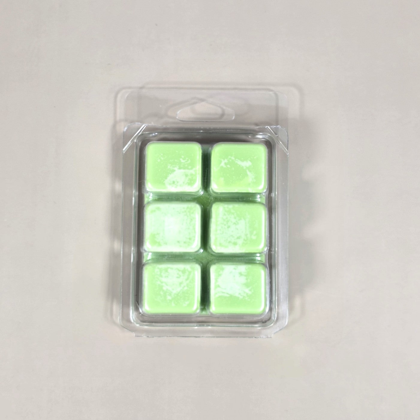 Labeled Eucalyptus & Spearmint soy wax melt in a 2.5oz clamshell. The premium label features high-resolution botanical imagery of fresh eucalyptus leaves and vibrant spearmint sprigs, emphasizing the natural aromatherapy profile.