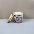Candle with a label featuring 'Fruity Pebbles' on a plain background