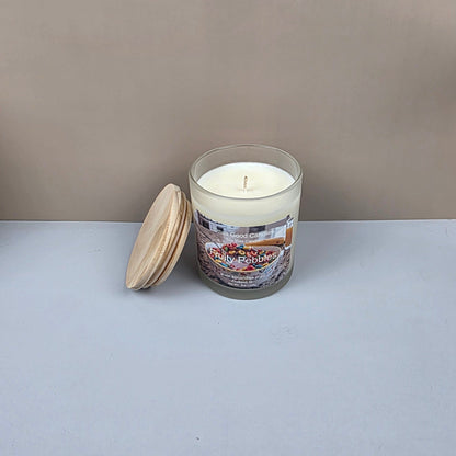 Candle with wooden lid on a white surface