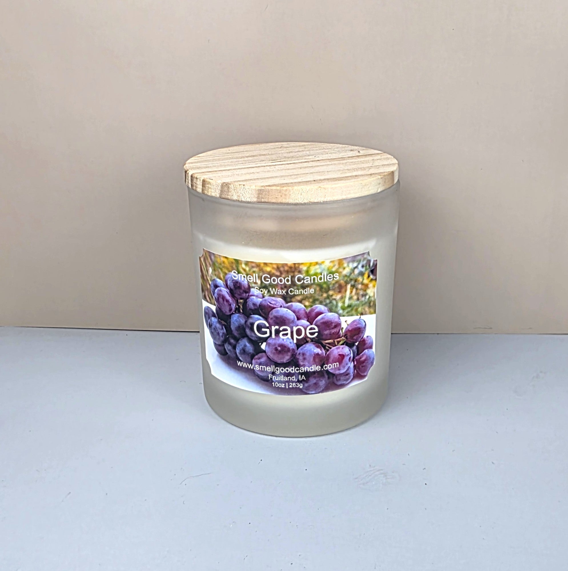 Grape soy wax candle in frosted jar with wood lid