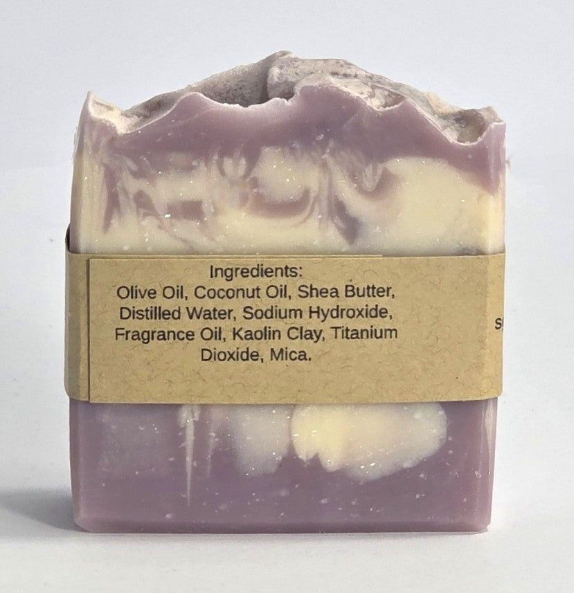 Ingredient list label on the back of a handmade Harvest Fig artisan soap bar featuring olive oil, shea butter, and coconut oil.
