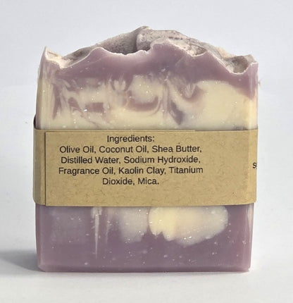 Ingredient list label on the back of a handmade Harvest Fig artisan soap bar featuring olive oil, shea butter, and coconut oil.