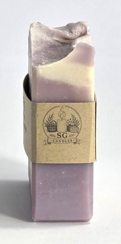 Smell Good Candles brand logo printed on the side paper band of a small-batch artisan soap bar.