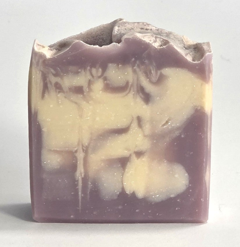 Unique handmade color pattern and textured natural texture of a Harvest Fig artisan soap bar.