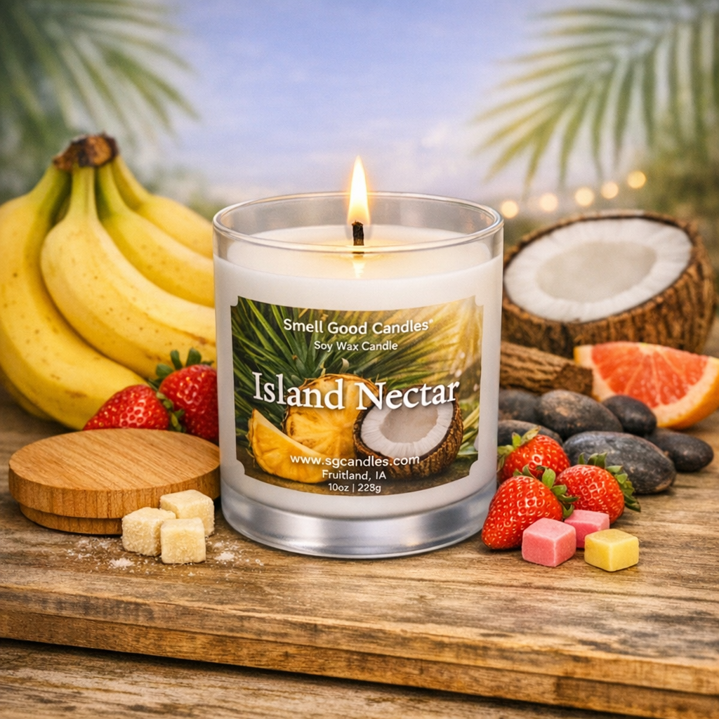 Island Nectar banana scented soy wax candle in a white frosted glass jar with pure white wax and lit wick, styled with bananas, strawberries, and tropical elements.
