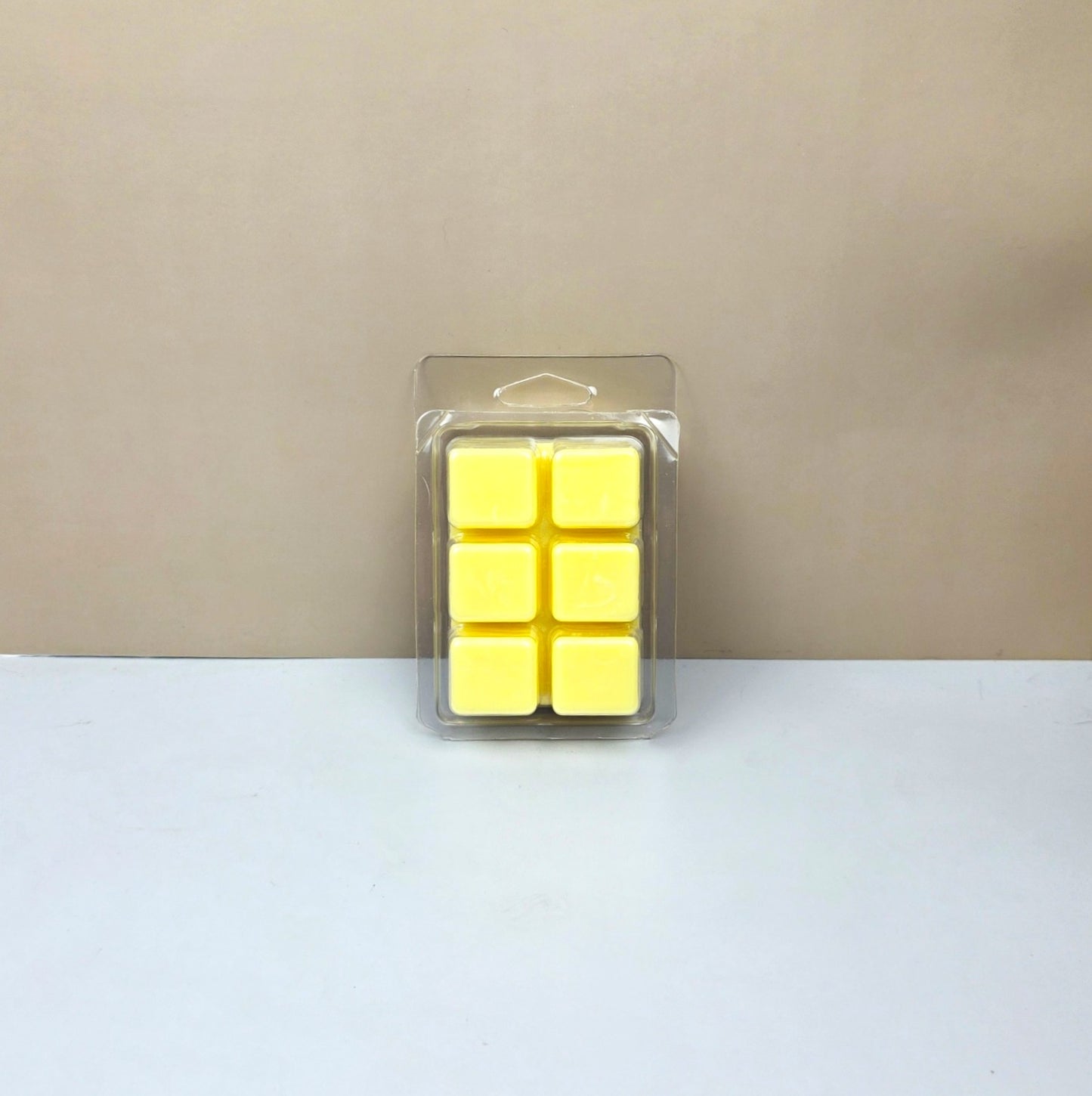 Close-up of the bottom of an Island Nectar wax melt mold showing six smooth, hand-poured tropical scented wax cubes.