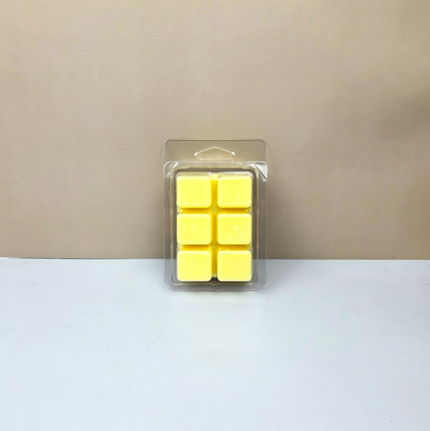 Close-up of the bottom of an Island Nectar wax melt mold showing six smooth, hand-poured tropical scented wax cubes.