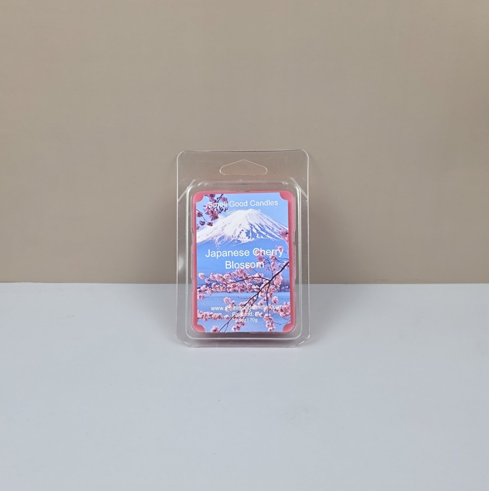 Packaged product with cherry blossom design on a plain background