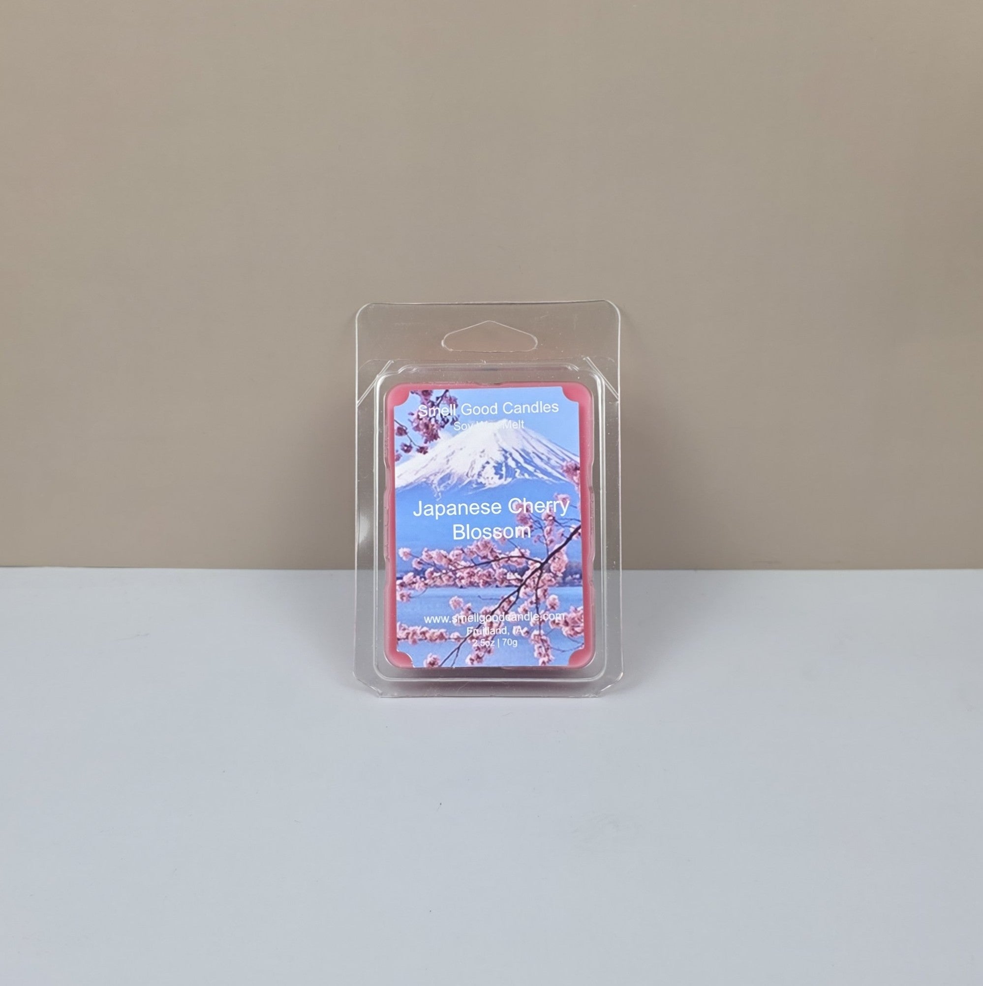 Packaged product with cherry blossom design on a plain background