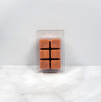 Masculine soy wax melt styled with dark oak and vanilla beans