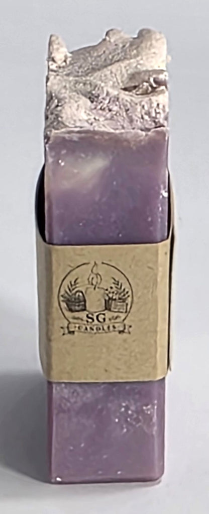 Smell Good Candles brand logo printed on the side paper band of a small-batch artisan soap bar.