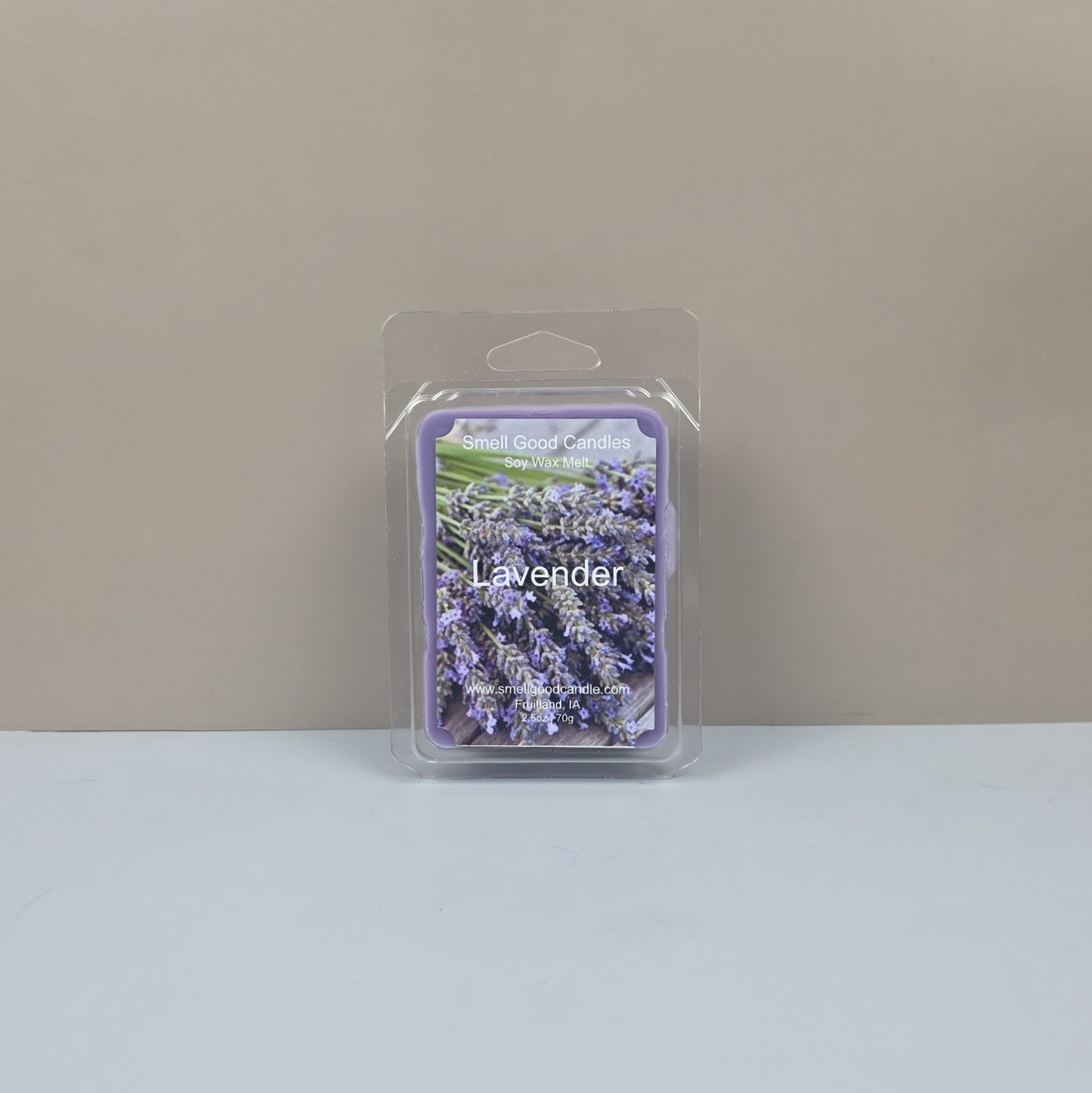 Packaged lavender candle melt on a neutral background