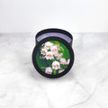 Lily of the Valley 8oz soy wax candle with soft floral and green notes.