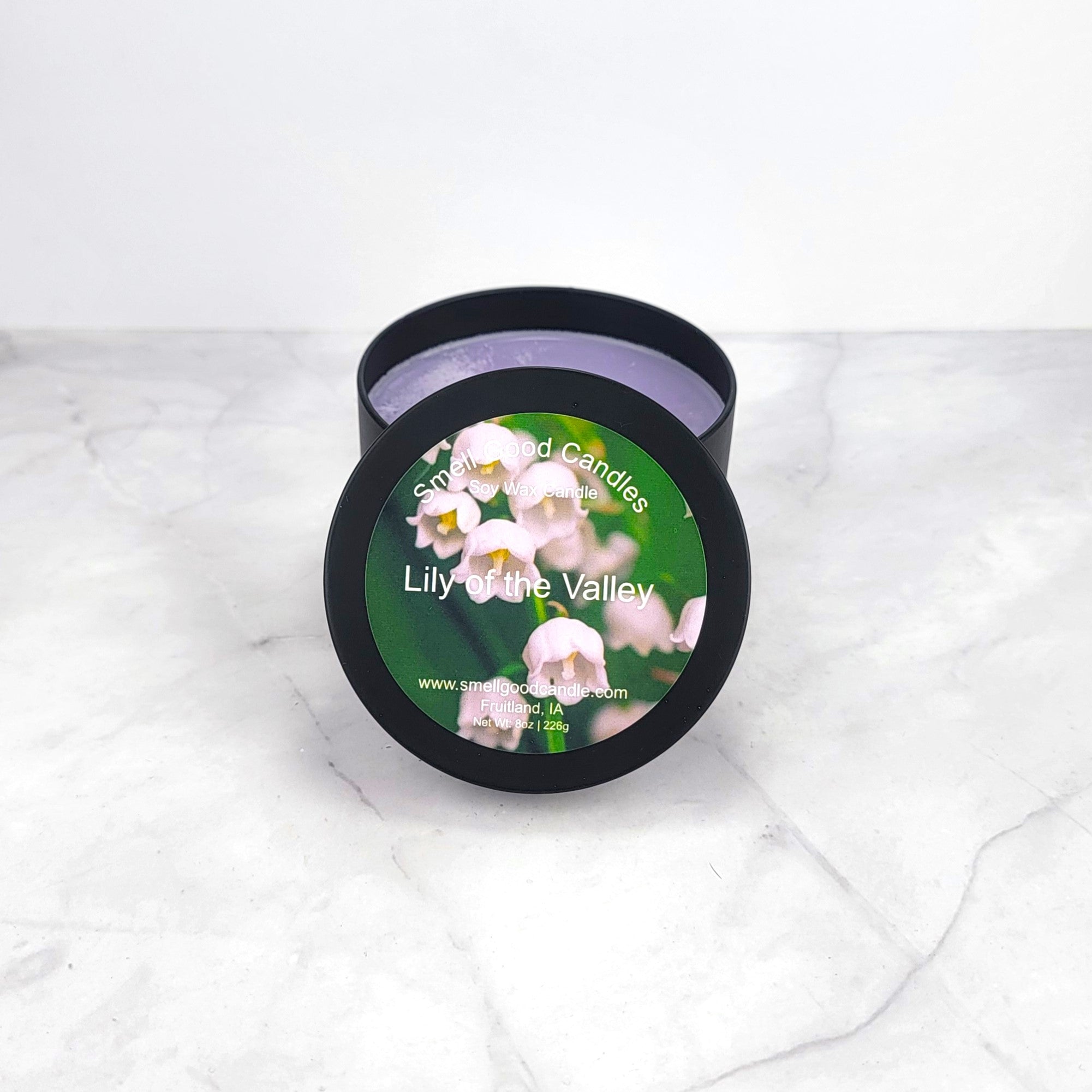 Lily of the Valley 8oz soy wax candle with soft floral and green notes.