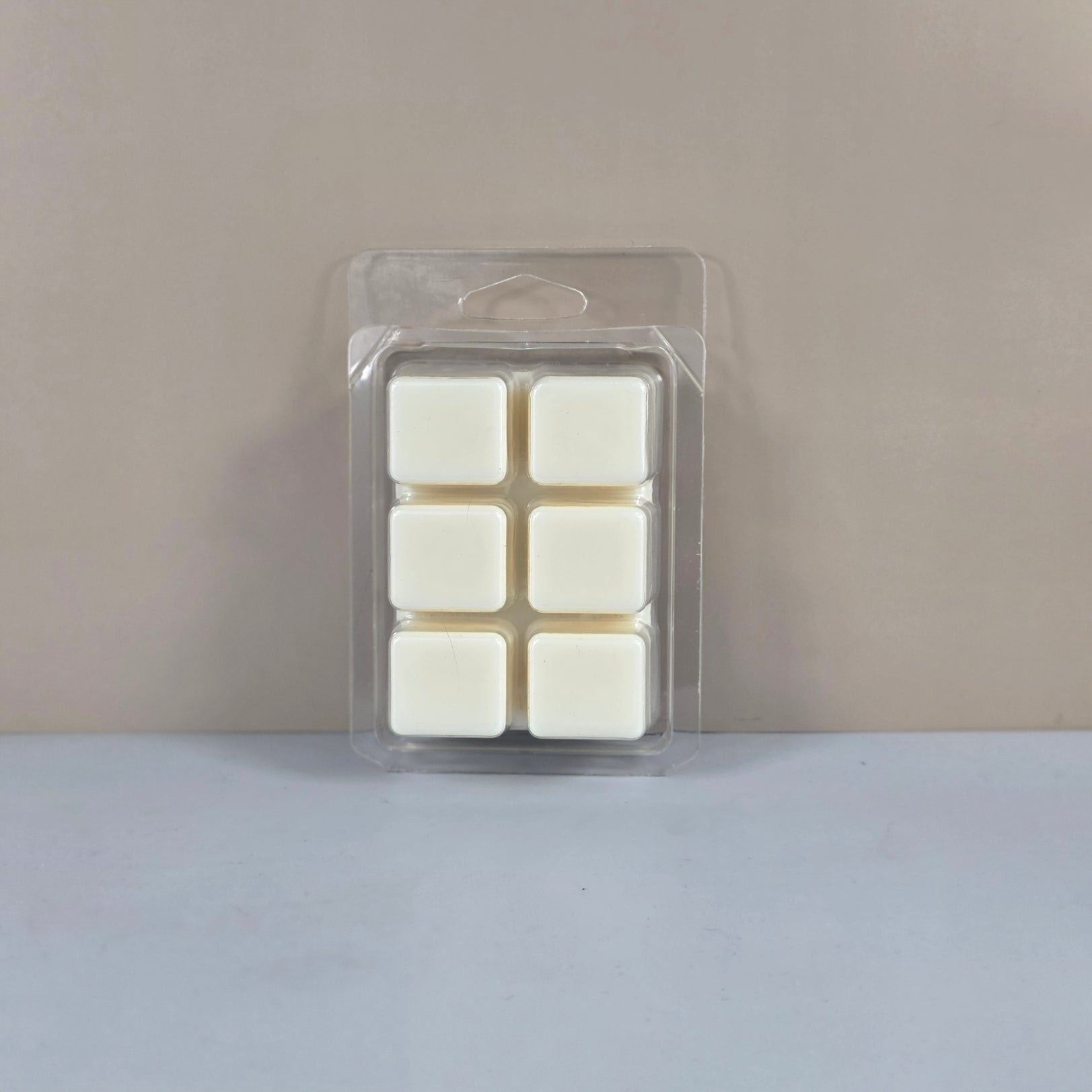 6-cube plastic clamshell packaging showcasing off-white, hand-poured soy wax melts.