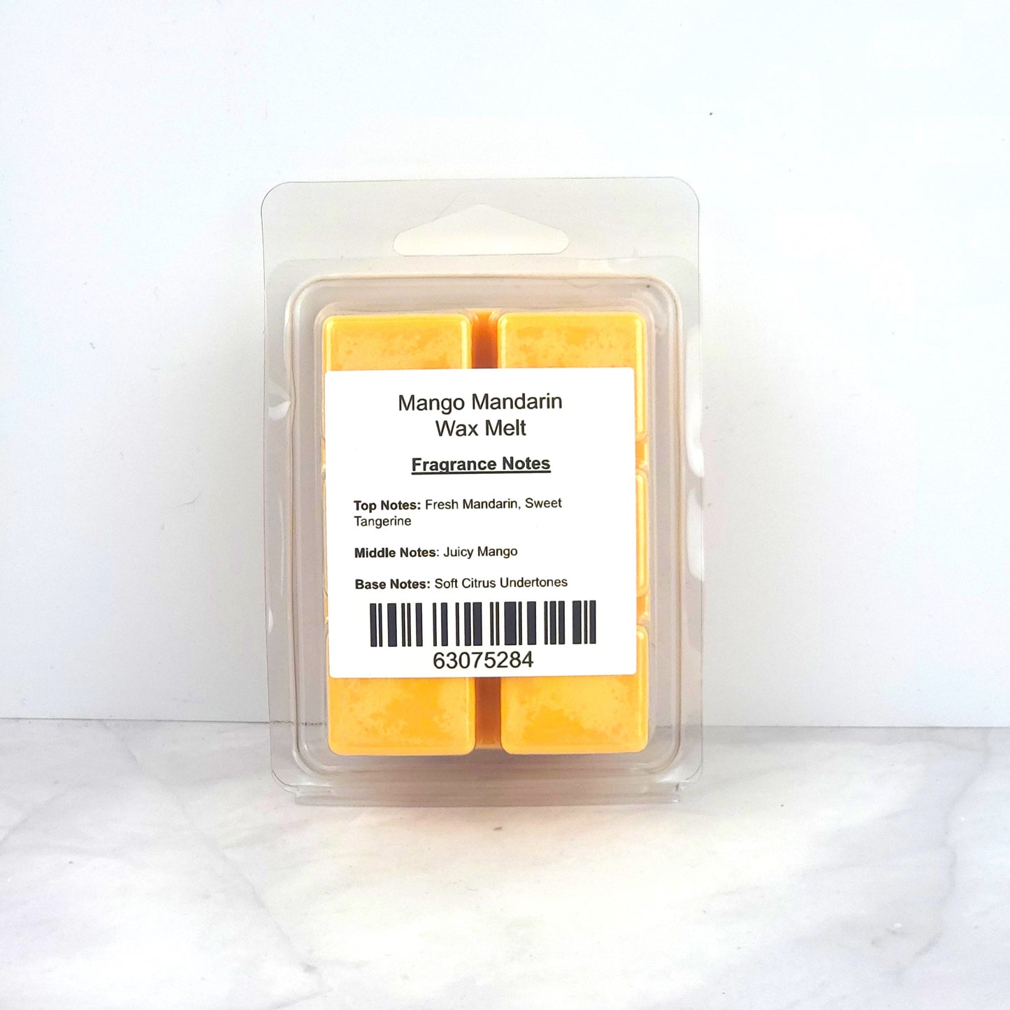 Hand-poured 100% soy wax melt with bright citrus and tropical mango fragrance, creating an uplifting and refreshing home scent.