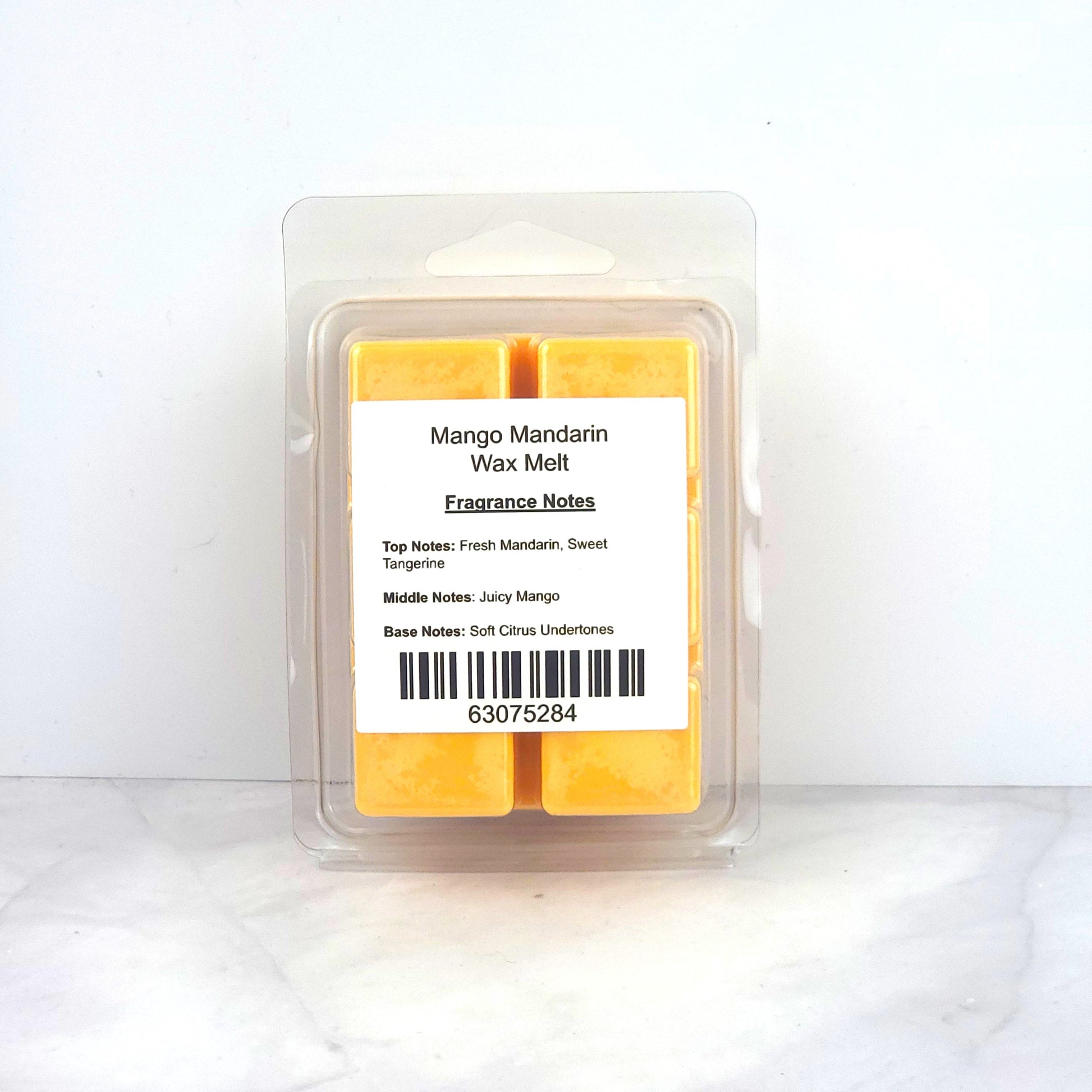 Hand-poured 100% soy wax melt with bright citrus and tropical mango fragrance, creating an uplifting and refreshing home scent.