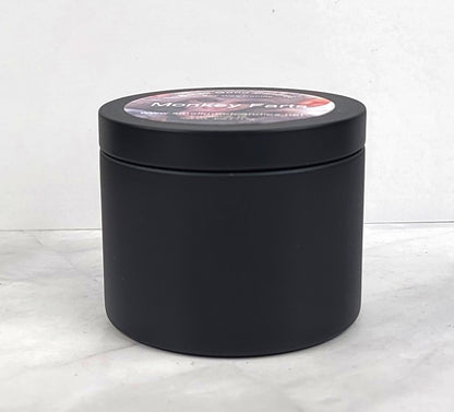 Monkey Farts 4oz Soy Candle in black candle tin showing side profile