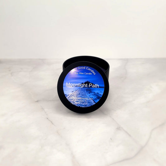 Moonlight Path 4oz soy candle with floral arrangement.