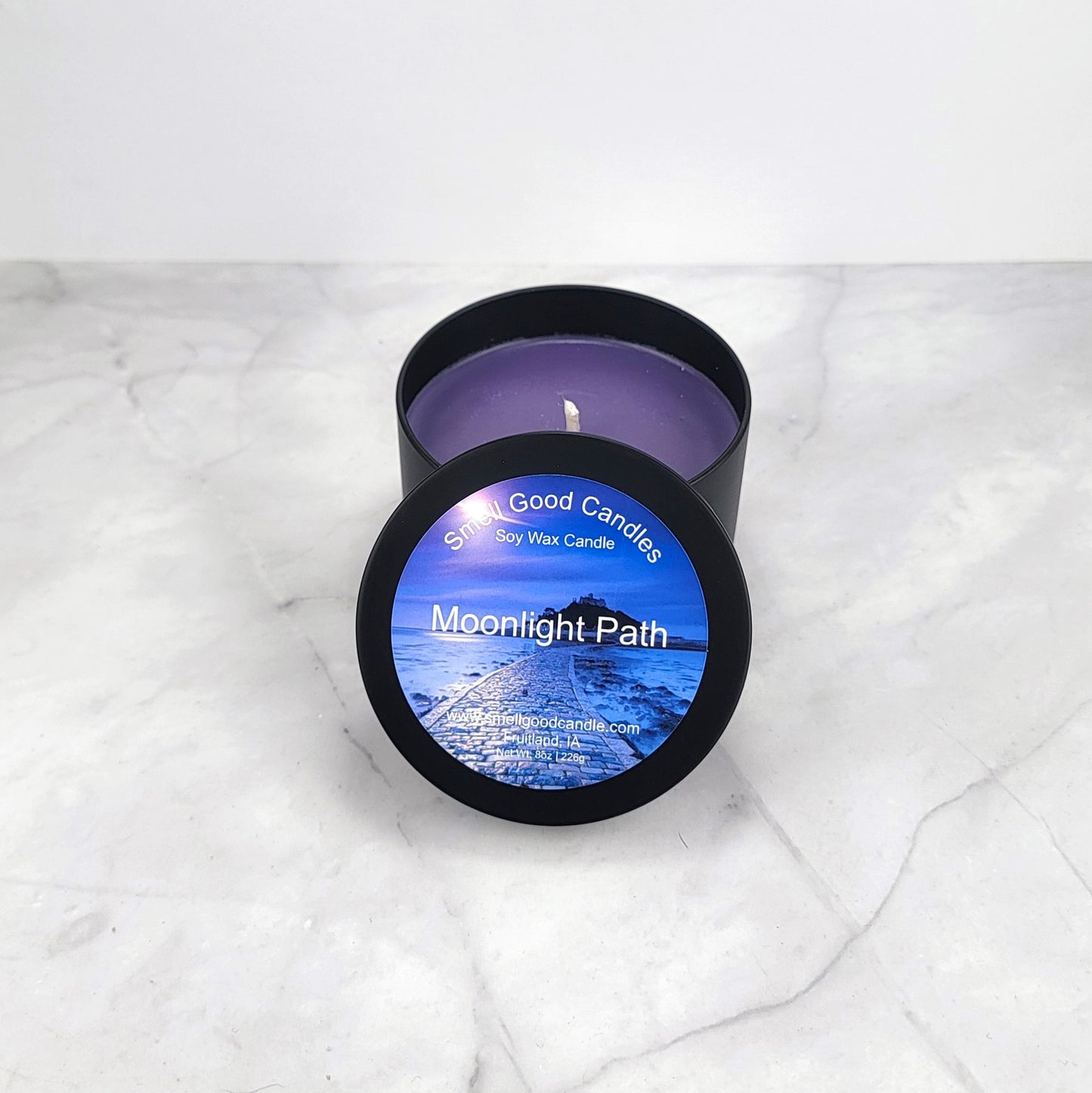 Hand-poured candle with delicate softwood and musk scent.