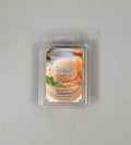Packaged orange sherbet scented wax melt on a gray background
