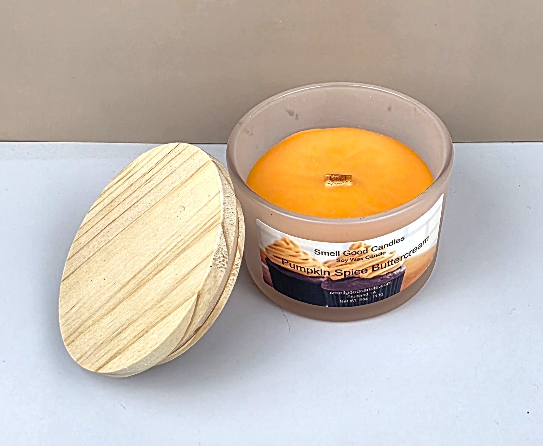 Hand-poured fall candle with cinnamon, clove, and buttercream scent