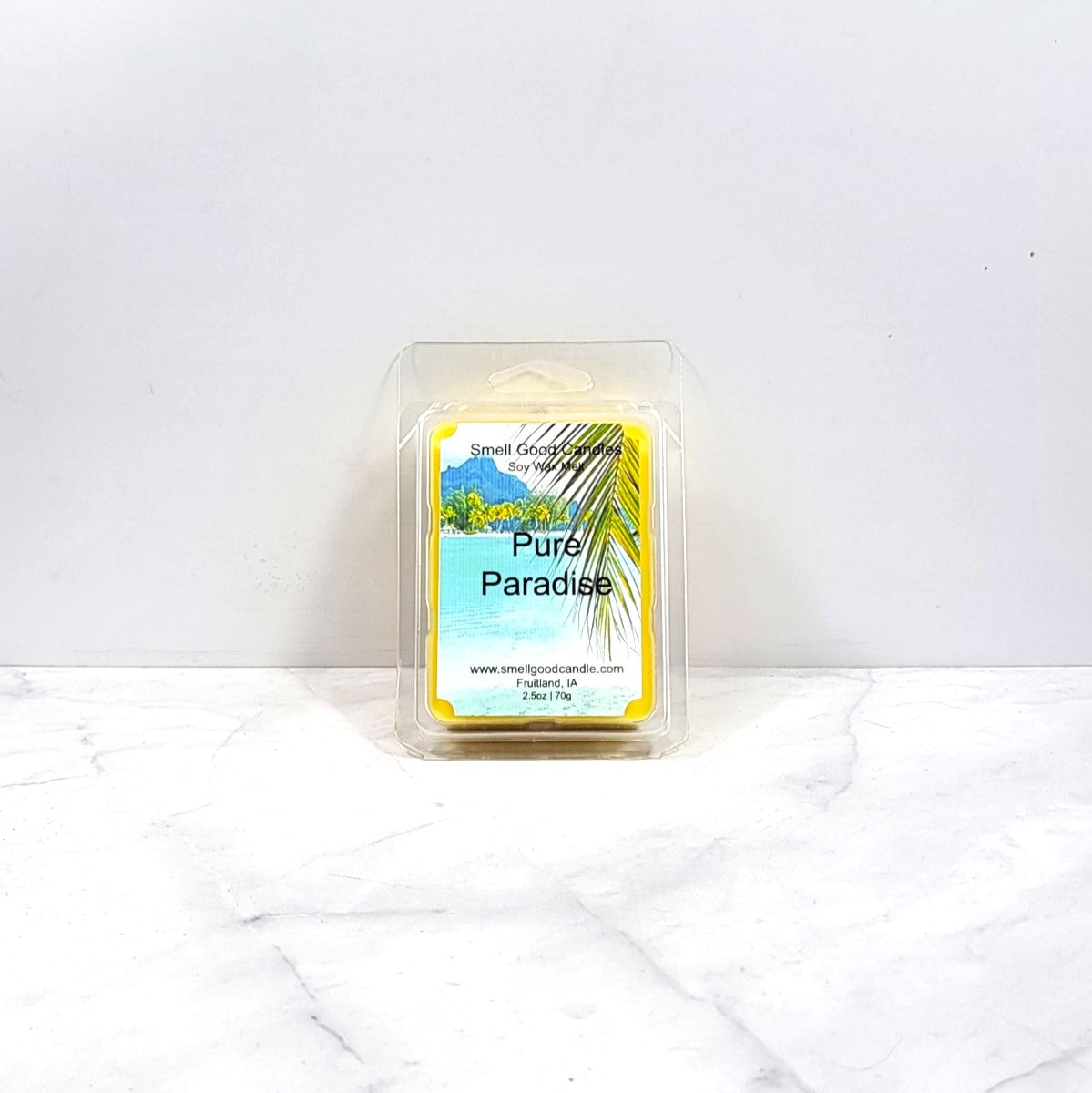 Wax melt container labeled 'Pure Paradise' on a white background