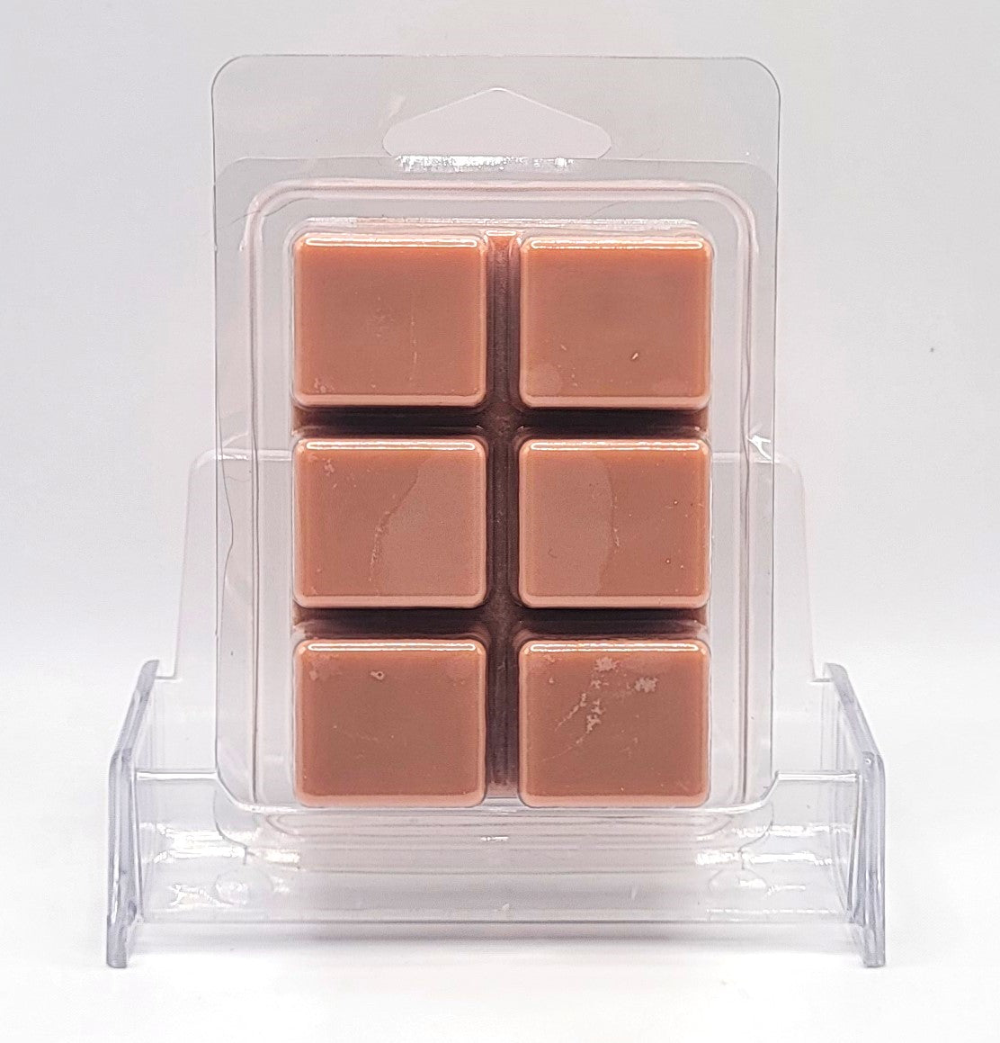 Close-up of 2.5oz Sandalwood Wax Melt with warm, amber glow