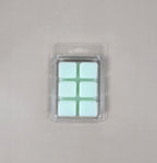Packaged product with six square compartments on a gray background